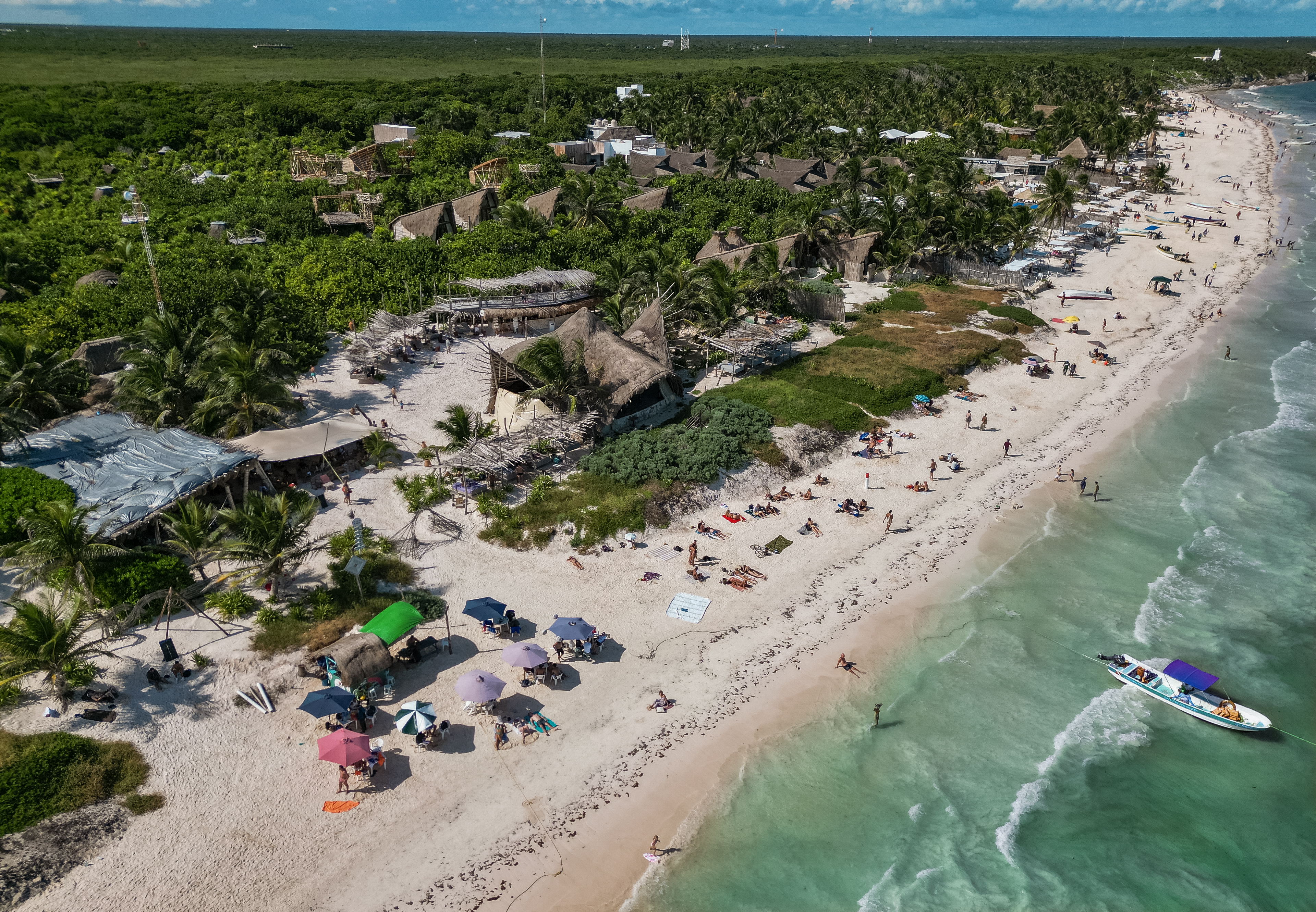 Drone shot of the IKAL beach club in Tulum on a sunny day.