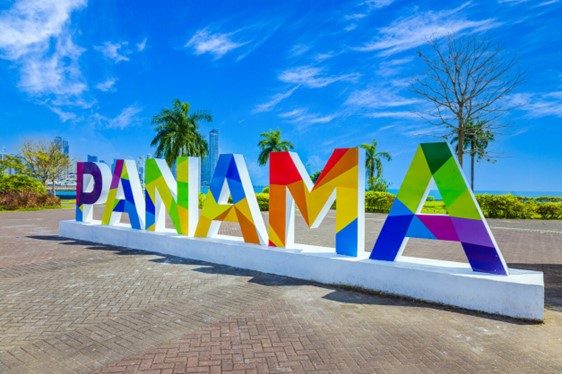 Colorful writing spelling out Panama against a blue sky background