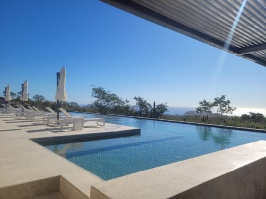 the infinity pool at Cabo Costa in Cabo, Mexico. The ocean is visable in the background.