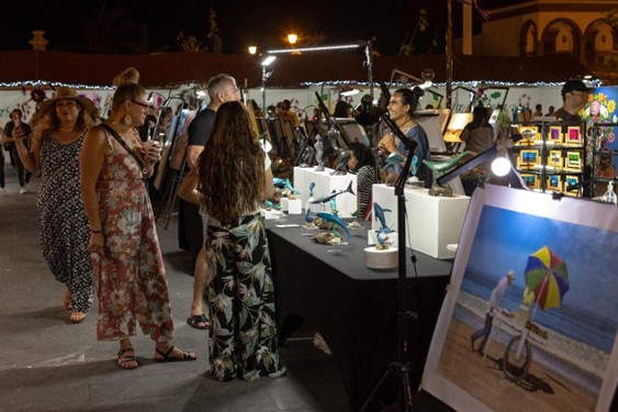 visitors enjoying the art walk at cabo