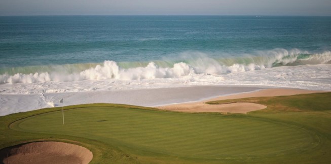 golf course in cabo with crashing surf in the background